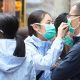 Hàng triệu người Trung Quốc ra đường phải đeo khẩu trang để ngăn sự lây lan của virus corona. Ảnh: SCMP.